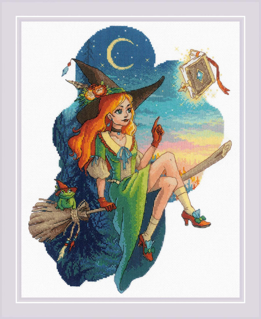 Cross stitch kit image featuring a young witch with red hair sitting on a broom, reading a book, with a moon and stars background.