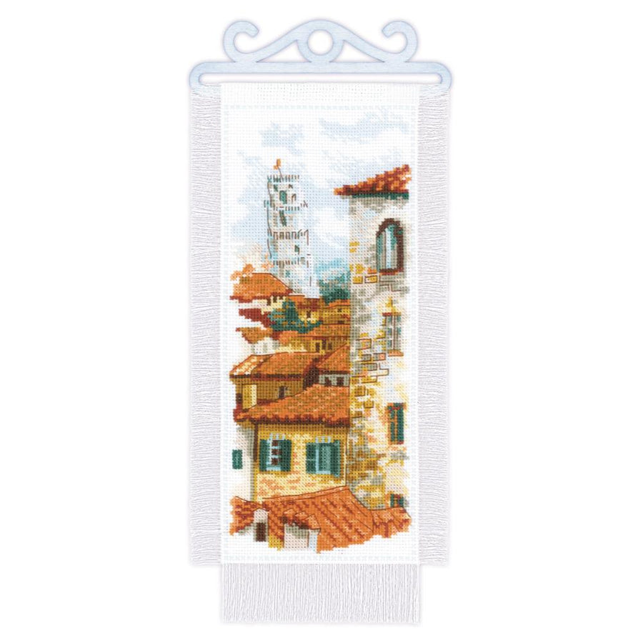 Riolis Pisa Roofs cross stitch kit, completed Italian cityscape embroidery featuring terracotta rooftops and the Leaning Tower.