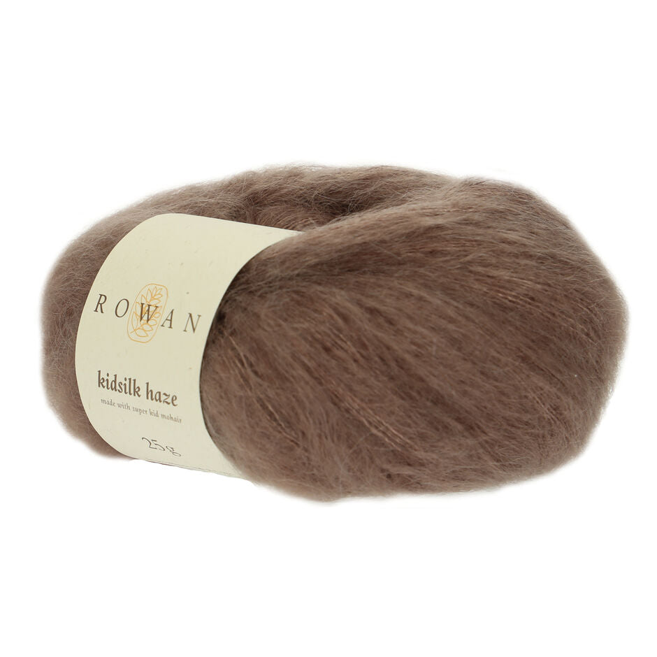 A skein of Rowan Kidsilk Haze yarn in a brown color with a label wrapped around it.