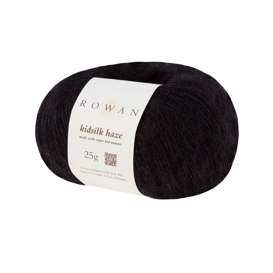 A skein of Rowan Kidsilk Haze yarn in  black color with a label wrapped around it.