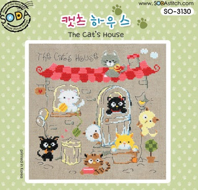 A small, square-format cross-stitch kit from SODA (Korea) titled 'The Cat's House.' The design features a whimsical illustrative scene of a cat's cozy home, complete with tiny furniture and feline-themed decor. The kit includes 28-count linen fabric, full skeins of DMC embroidery threads, and a needle. The finished design is a delicate square measuring 11 cm by 11 cm