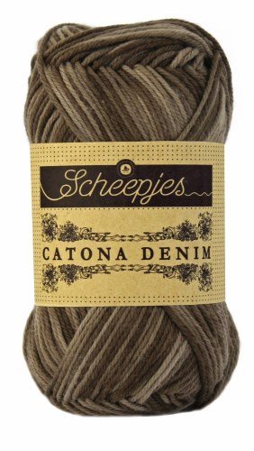 A 50g ball of Scheepjes Catona Denim yarn, showing the 100% natural cotton fibers with a subtle, variegated denim-effect colorway in dark brown/ grey colourway