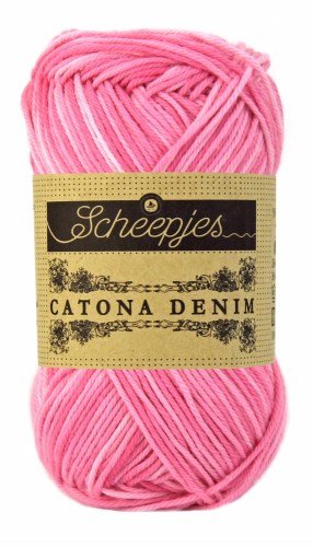 A 50g ball of Scheepjes Catona Denim yarn, showing the 100% natural cotton fibers with a subtle, variegated denim-effect colorway in pink