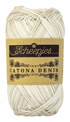 A 50g ball of Scheepjes Catona Denim yarn, showing the 100% natural cotton fibers with a subtle, variegated denim-effect colorway in white beige colour