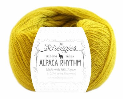 A skein of Scheepjes Alpaca Rhythm yarn in a multicolor pattern, with the brand and product name displayed on the label in yellow colour
