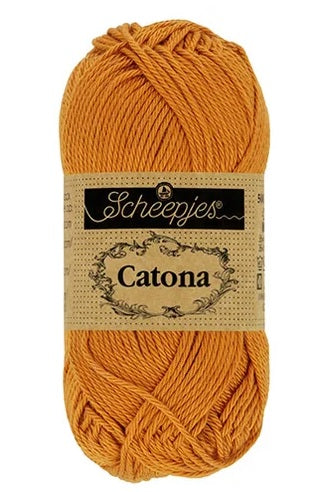 Close-up of Scheepjes Catona 50g cotton showing the smooth, fuzz-free texture and vibrant Ginger Gold Color tone for high-definition stitch work