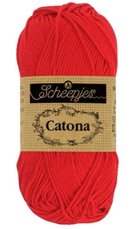 Close-up of Scheepjes Catona 50g cotton showing the smooth, fuzz-free texture and vibrant Hot Red tone for high-definition stitch work