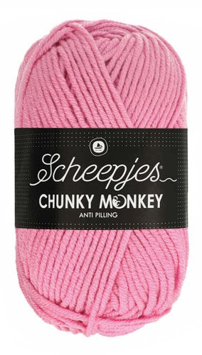 Hypoallergenic & Soft: 100% premium acrylic yarn that feels incredibly soft against the skin—perfect for those who find wool too itchy. A lush, oversized ball of Scheepjes Chunky Monkey Aran yarn in a vibrant solid color, featuring a thick, smooth twist and a subtle silky sheen in rose colour