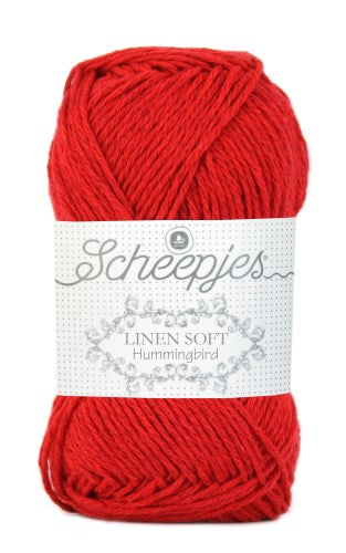 A skein of Scheepjes Linen Soft yarn in Cherry Red color, with brand label visible.