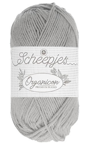 "A 50g ball of Scheepjes Organicon yarn in a soft pastel shade, showcasing its smooth matte finish and 100% organic cotton texture in silver grey