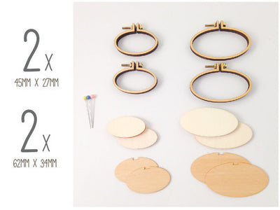 Close-up of the Dandelyne kit components: tiny wooden hoop frames, center plates, and the precise screws and bolts for assembly