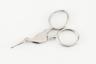 A pair of miniature 'Storklette' embroidery scissors, featuring the classic bird-shaped design in a compact 40x70mm size. Shown in various vibrant and metallic finishes, these stainless steel scissors highlight their sharp precision tips and portable scale, perfect for travel sewing kits