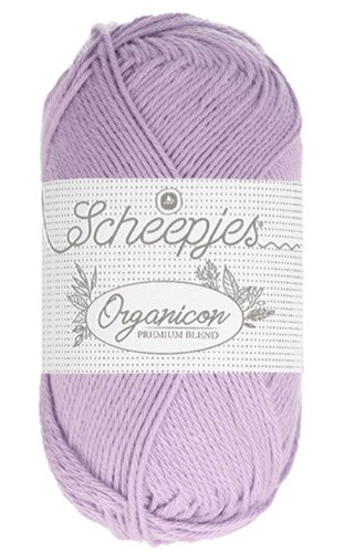 A person holding a ball of light blue yarn with 'Organicon' in liliac colour. 

branding, Hypoallergenic crochet cotton, eco-friendly knitting supplies, organic cotton for amigurumi, softest cotton for newborns, sustainable fiber arts