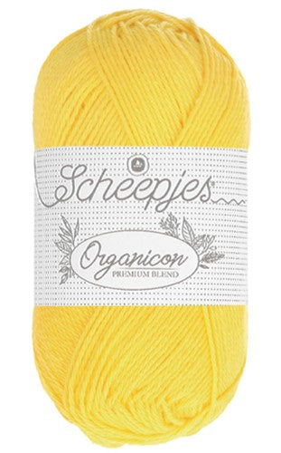 A 50g ball of Scheepjes Organicon yarn in a soft pastel shade, showcasing its smooth matte finish and 100% organic cotton texture.
in primrose yellow colour