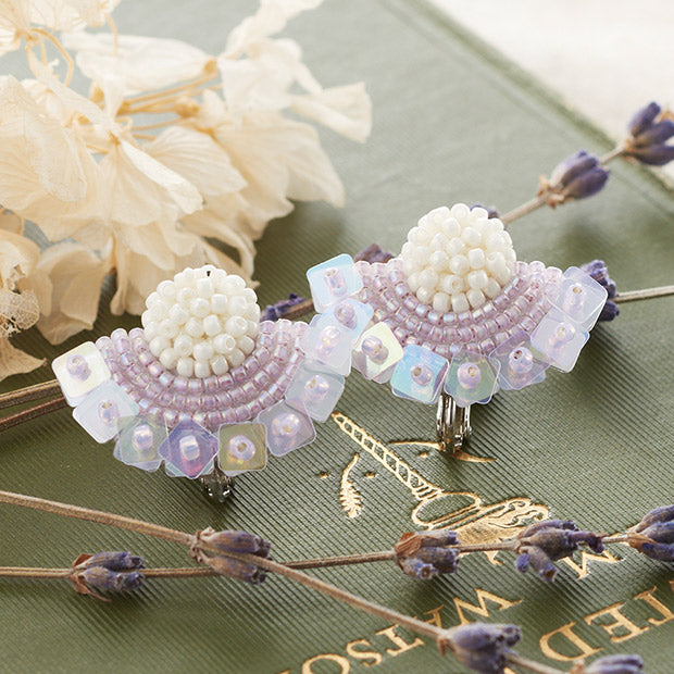 Close-up of the Maison De Broderie earring kit, showcasing the intricate floral design and the high-luster finish of the precision-cut TOHO beads in a sophisticated metallic and pastel palette.