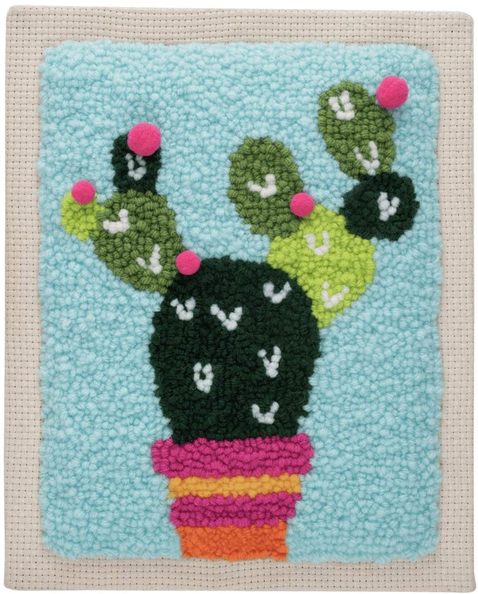 A complete 'Cactus' punch needle starter kit by Trimits. The kit includes a 20.32 x 25.4 cm (8x10 inch) fabric panel pre-stretched on a wooden frame with a printed cactus outline. Also included are vibrant green and terracotta yarns, a punch needle tool, a needle threader, and a large color reference image