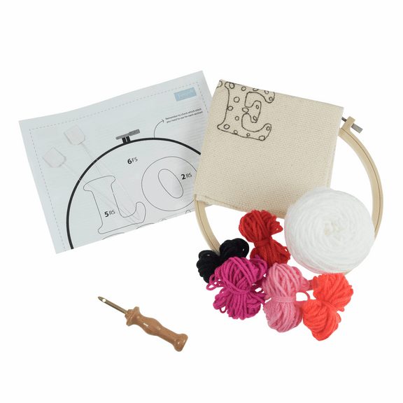 The kit features a 20.32cm (8-inch) non-slip plastic hoop, pre-printed 11-count punch needle fabric with a bold 'Love' motif, colorful yarns, a punch needle tool, and a needle threader.