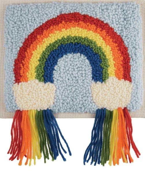 A punch needle kit with a rainbow design, featuring a stretched canvas with a printed outline, punch needle tool, needle threader, yarn, and instructions.