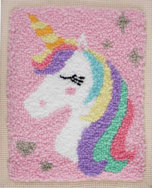 A magical 'Unicorn' punch needle starter kit by Trimits. The kit includes an 8x10 inch fabric panel pre-stretched on a wooden frame with a printed unicorn silhouette. It features a palette of pastel and vibrant yarns, a specialized punch needle tool, a needle threader, and a large color image for easy reference.
