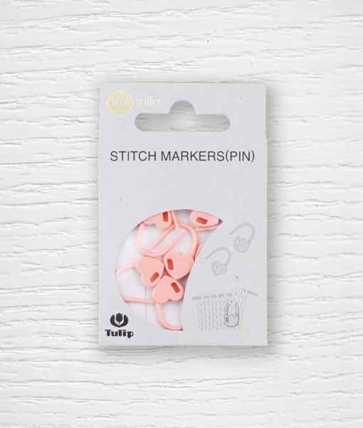 Pack of pink heart-shaped stitch markers on a card, with the brand name 'Tulip' visible.