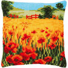 A Vervaco needlepoint kit featuring the 'Poppies Landscape' design. The image showcases a stunning field of bright red poppies against a lush green background. The kit includes a premium large-hole Zweigart canvas with the design hand-painted on the threads, thick acrylic yarn, and a tapestry needle, intended for a 40cm x 40cm cushion front