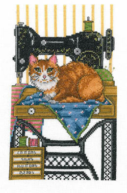 A cross stitch kit image featuring a sewing machine with a cat resting on it, stitched on a fabric with a blue and red pattern.
The Joan A. Elliott 'Vintage Sewing Cat' cross-stitch kit featuring a detailed cat surrounded by vintage sewing notions and shimmering gold accents.

Cat Cross Stitch with Metallic Thread