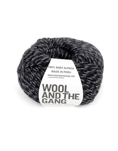 A blue skein of WOOL AND THE GANG Sugar Baby Alpaca yarn with a label in the center in black grey twist colour