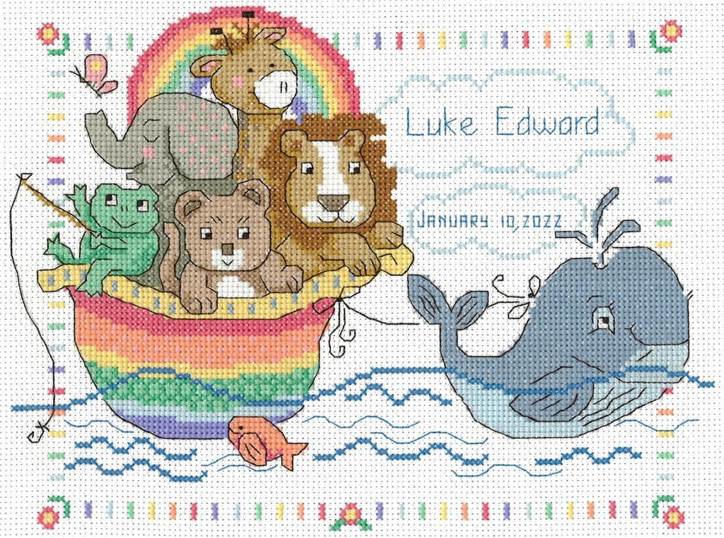 Close-up of the "Whale of A Welcome" embroidery design, showcasing the playful whale motif, decorative water droplets, and the soft, ocean-inspired color palette of the included threads.