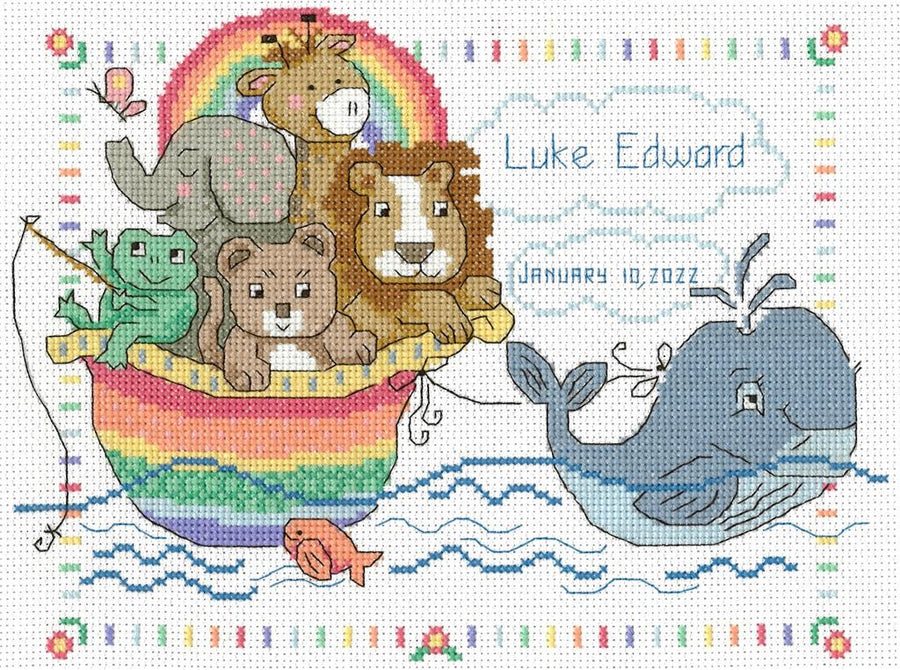 Close-up of the "Whale of A Welcome" embroidery design, showcasing the playful whale motif, decorative water droplets, and the soft, ocean-inspired color palette of the included threads.
