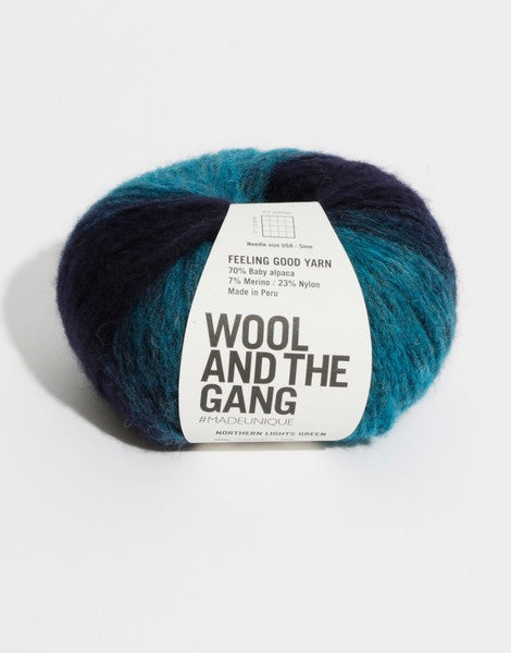 Close-up of Feeling Good yarn, highlighting the delicate Baby Alpaca fibers held within a fine cage structure for a weightless, cloud-like feel in Northern light green shades stripe colour.