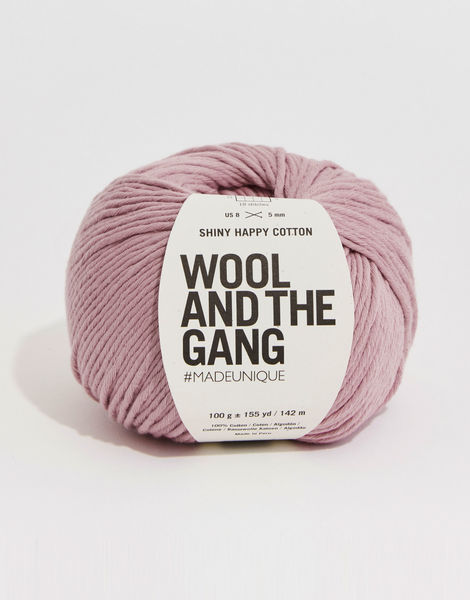 A 100g ball of Wool and the Gang Shiny Happy Cotton yarn in a vibrant mauve shade, showing its smooth texture and subtle natural sheen. Best Cotton Yarn for Summer, Luxury Aran Cotton, WATG Yarn Singapore.