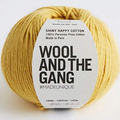 A 100g ball of Wool and the Gang Shiny Happy Cotton yarn in a vibrant Chalk yellow shade, showing its smooth texture and subtle natural sheen