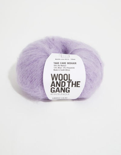 A voluminous 50g ball of Wool and the Gang Take Care Mohair, showing its iconic fluffy halo and soft, radiant fiber texture in lilac purple colour