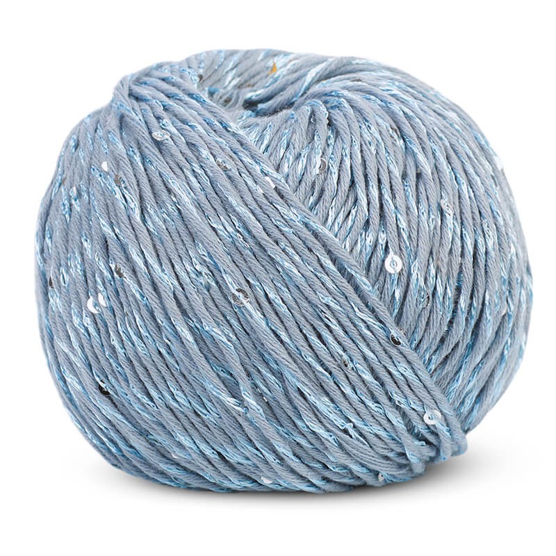 A 50g ball of DMC Natura Glam yarn, showing the beautiful twist of plain cotton thread with a matching sequined strand in baby blue