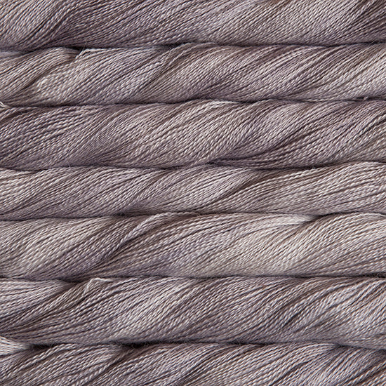 Hand-Dyed Lace Weight Yarn, Luxury Silk Knitting Fiber, Malabrigo Singapore.
A 50g skein of Malabrigo Silpaca yarn, showcasing its signature hand-dyed variegation and the luminous sheen of the silk-alpaca blend in Pearl colour