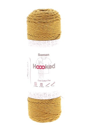 "A 100g ball of Hoooked Somen yarn, showing its beautiful matte texture and the subtle, natural variations of the cotton-linen blend in ambra mustard yellow colour.