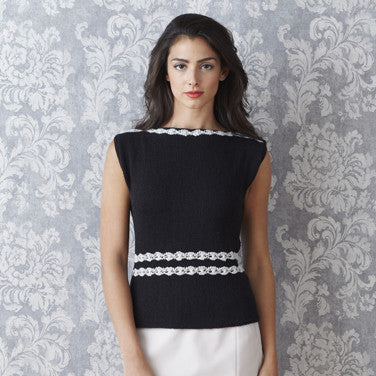 A selection of 12 designs from the Sublime collection, featuring delicate lace cover-ups and striking, elegant sweaters for women wearing a black knitted top with crochet flora edging.