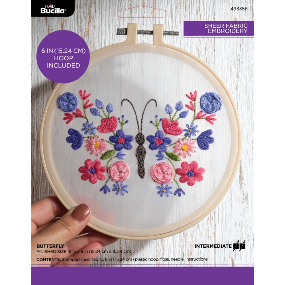 Packaging for a Bucilla stamped embroidery kit featuring a butterfly design on a sheer fabric, with a 6-inch plastic hoop and embroidery floss included.