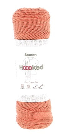 Close-up of Hoooked Somen fibers, highlighting the soft recycled cotton plies interwoven with strong natural flax for a durable summer thread on coral color
