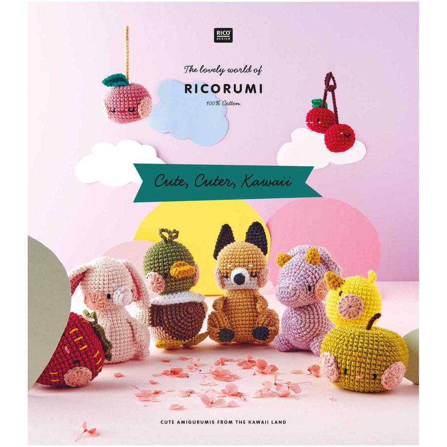 A colorful crochet pattern book cover featuring various cute animal characters designed in kawaii style. Front cover of the Ricorumi Cute Cuter Kawaii book featuring a pastel pink background with a crocheted baby dino and a happy strawberry