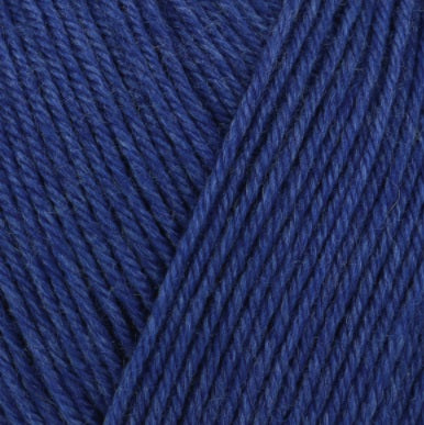 A skein of Schachenmayr Regia Premium Silk yarn in pink color, labeled as 4-ply with 100g/400m length in navy blue colour