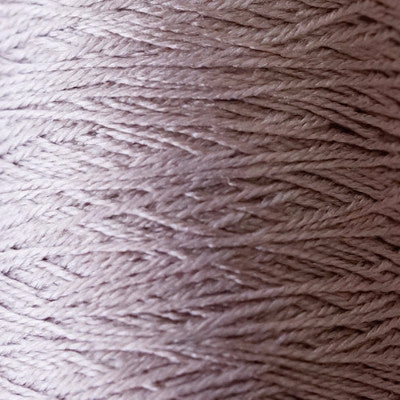 A 50g cone of Pierrot Silk100 lace yarn in a shifting iridescent shade, showcasing the high-gloss lustre of pure Japanese silk."