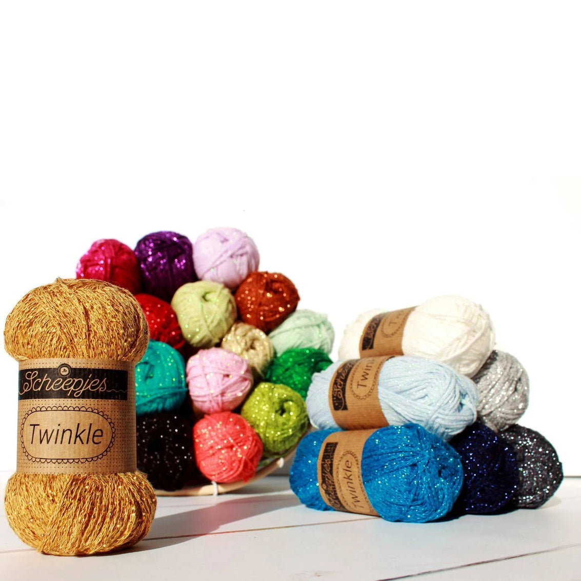 A ball of Scheepjes Twinkle sparkling yarn; the ideal choice for handmade Christmas ornaments, glittery coasters, and elegant evening shawls. A soft cotton-blend yarn featuring a subtle metallic sparkle for festive crochet and knitting