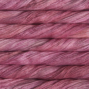 Hand-Dyed Lace Weight Yarn, Luxury Silk Knitting Fiber, Malabrigo Singapore.
A 50g skein of Malabrigo Silpaca yarn, showcasing its signature hand-dyed variegation and the luminous sheen of the silk-alpaca blend in pink colour